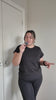 A size XL women explaining that these custom designed activewear leggings are the best and most functional for running and intense workouts. she says these are non-slip, won't fall down and are the best leggings for working out in australia
