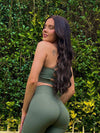 A photo of a lovely girl named Chloe, in our Sage Green Bike Shorts. She is showing off the back, whilst showing her face and smiling.