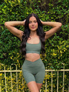 A picture of a lovely girl named Chloe, showing off the Sage Green Bike Shorts. Pose to the front.