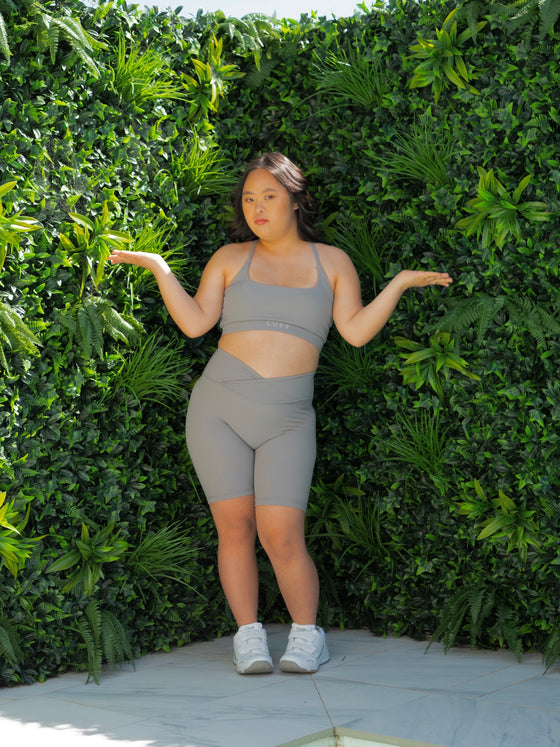 Yena in the Cloud Light Grey Bike Shorts and Majestic bra, styled criss cross at the back.