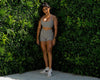 Our lovely model Aakansha is wearing our Lavish Mid Length Shorts in Cloud Grey. She is posing to the front, with one leg infront of the other.