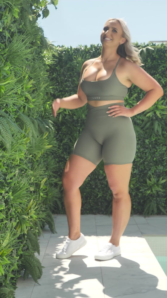 A video of Maddi from photoshoot day showing off the front and back of her Sage Green Majestic bra. Maddi is wearing it criss cross at the back.